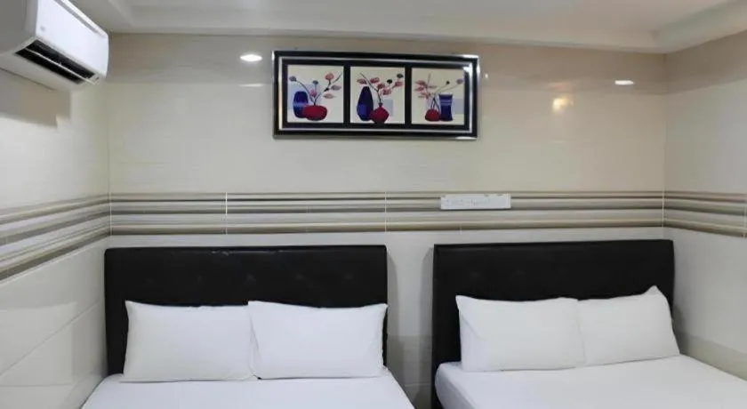 Bed in New Wave Hotel Melawati