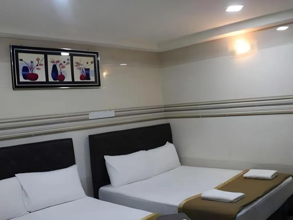 Bed in New Wave Hotel Melawati