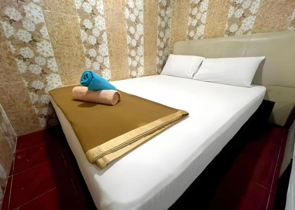 Bed in New Wave Hotel Melawati