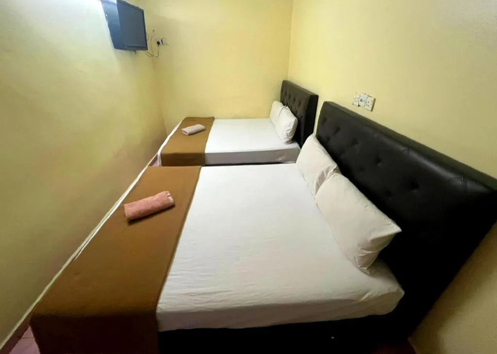 Bed in New Rawang Hotel