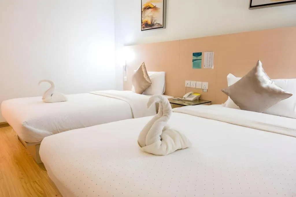 Bed in Hotel City Comfort Inn