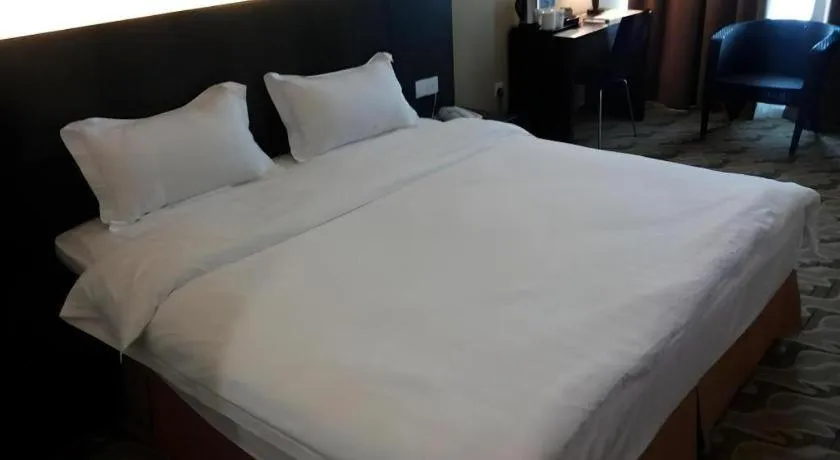 Bed in Eminent Hotel