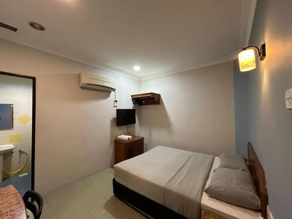 Bed in Sherrinton Hotel