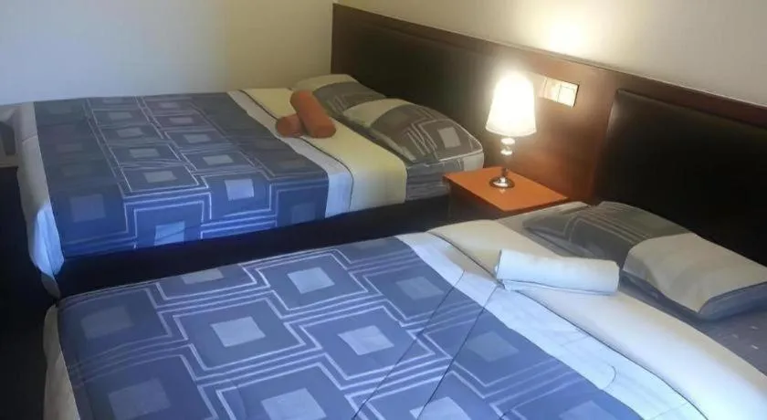 Bed in Camlodge Budget Hotel