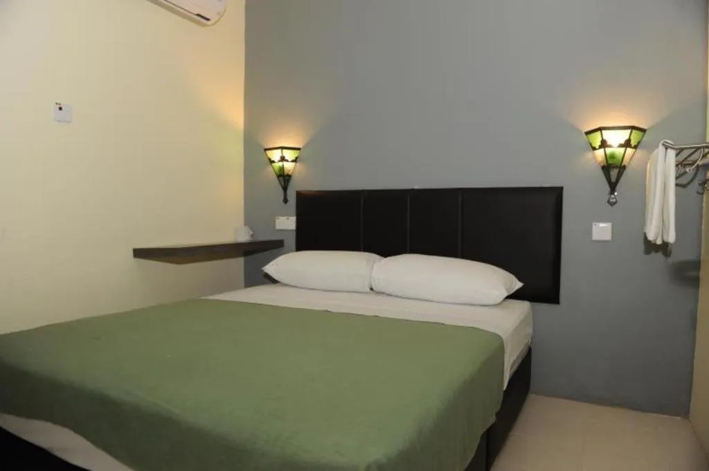 Bed in Kuok Pin Hotel