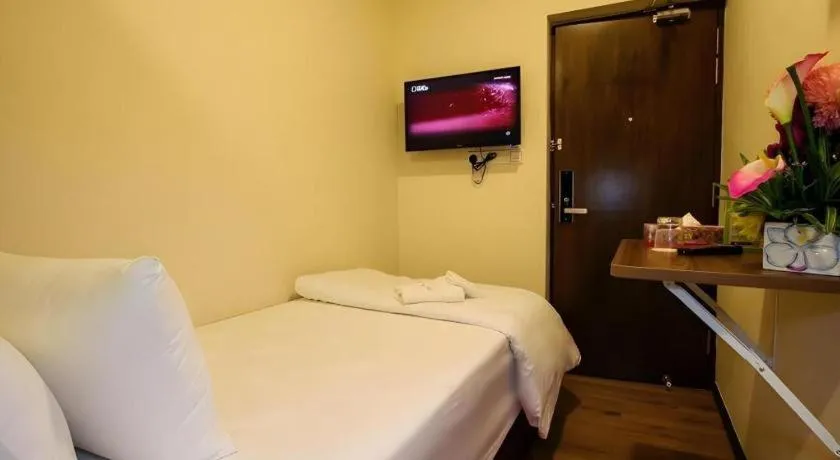 Bed in Tropicana Boutique Hotel