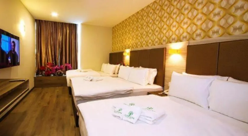 Bed in Tropicana Boutique Hotel