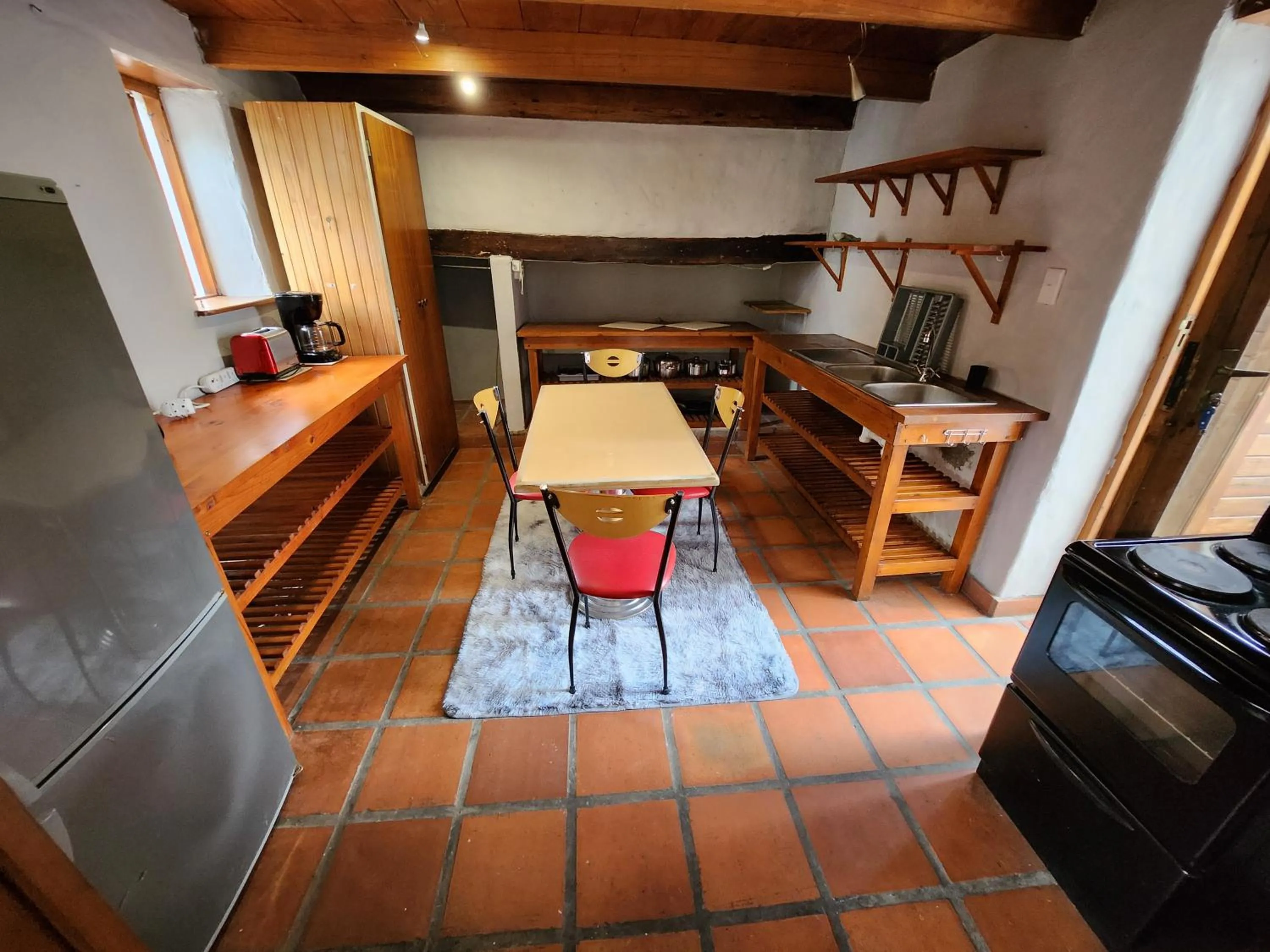 Kitchen or kitchenette in The Village Lodge