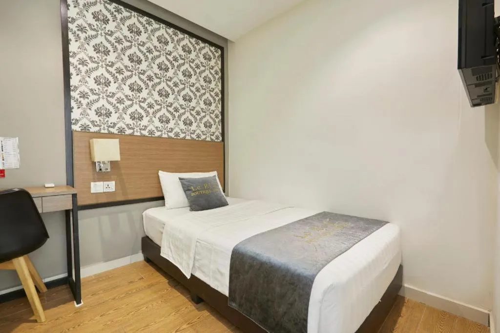 Bed in Le Ruiz Boutique Hotel