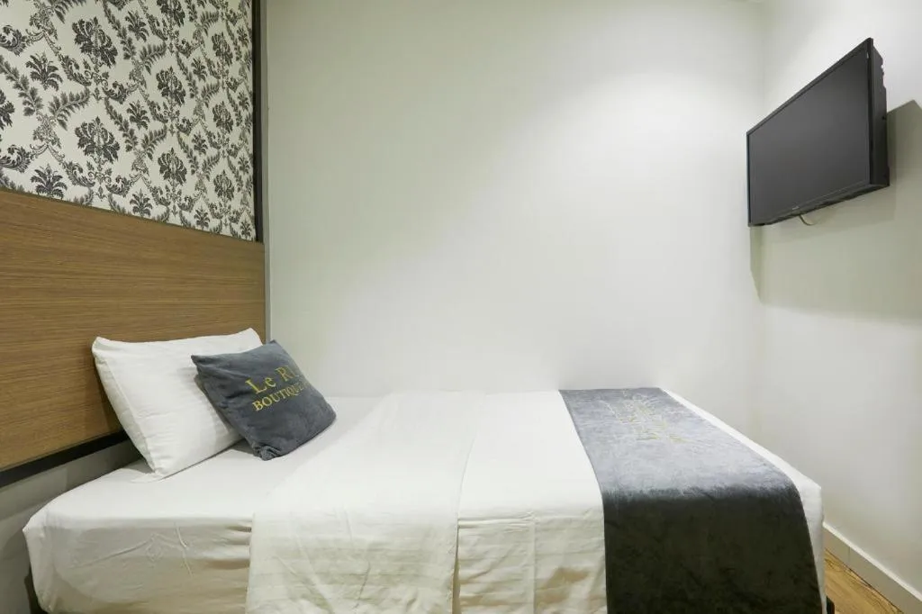 Bed in Le Ruiz Boutique Hotel