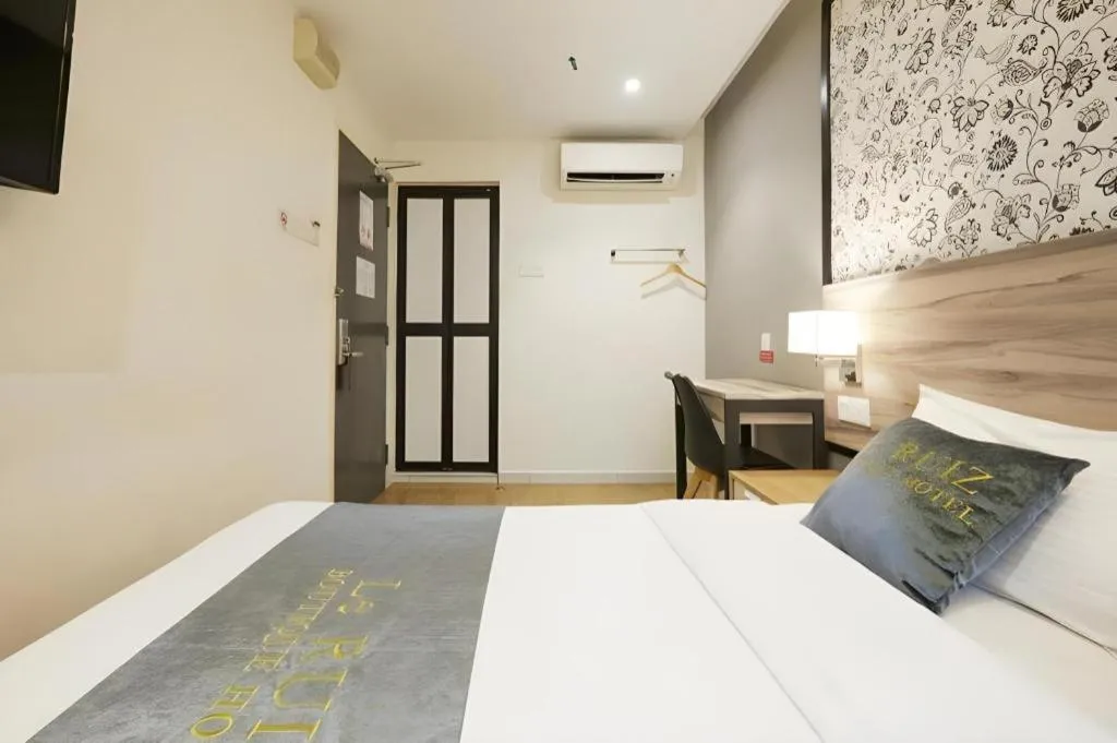 Bed in Le Ruiz Boutique Hotel