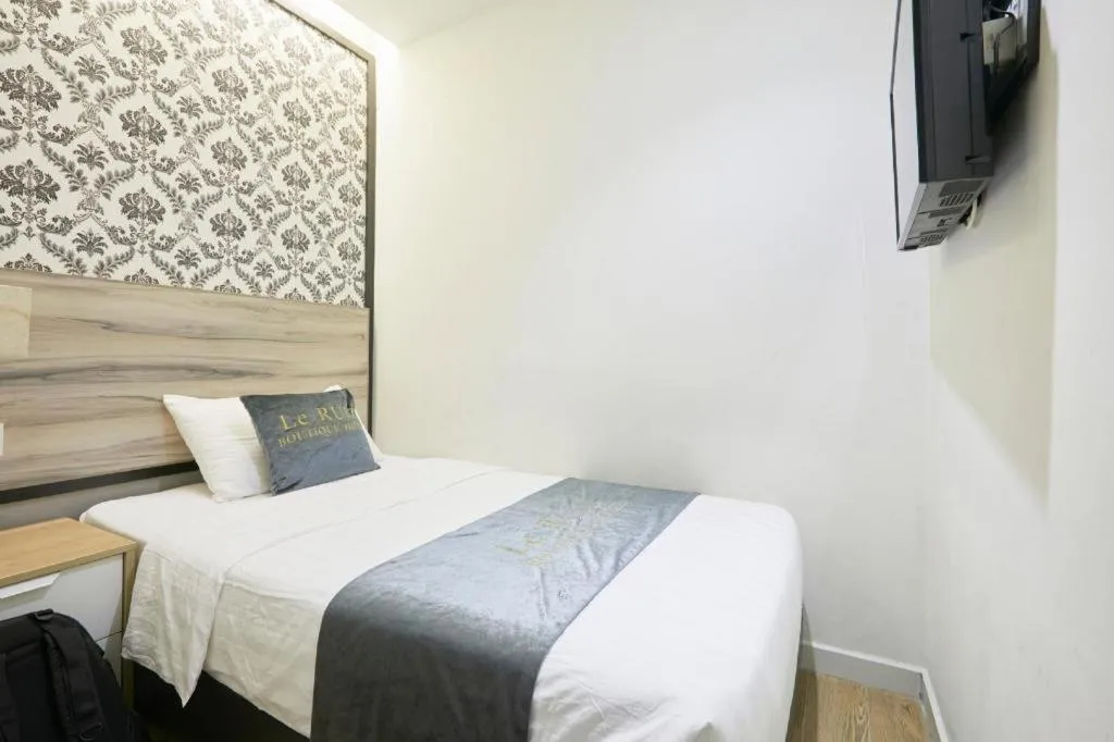 Bed in Le Ruiz Boutique Hotel