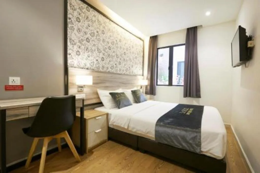 Bed in Le Ruiz Boutique Hotel