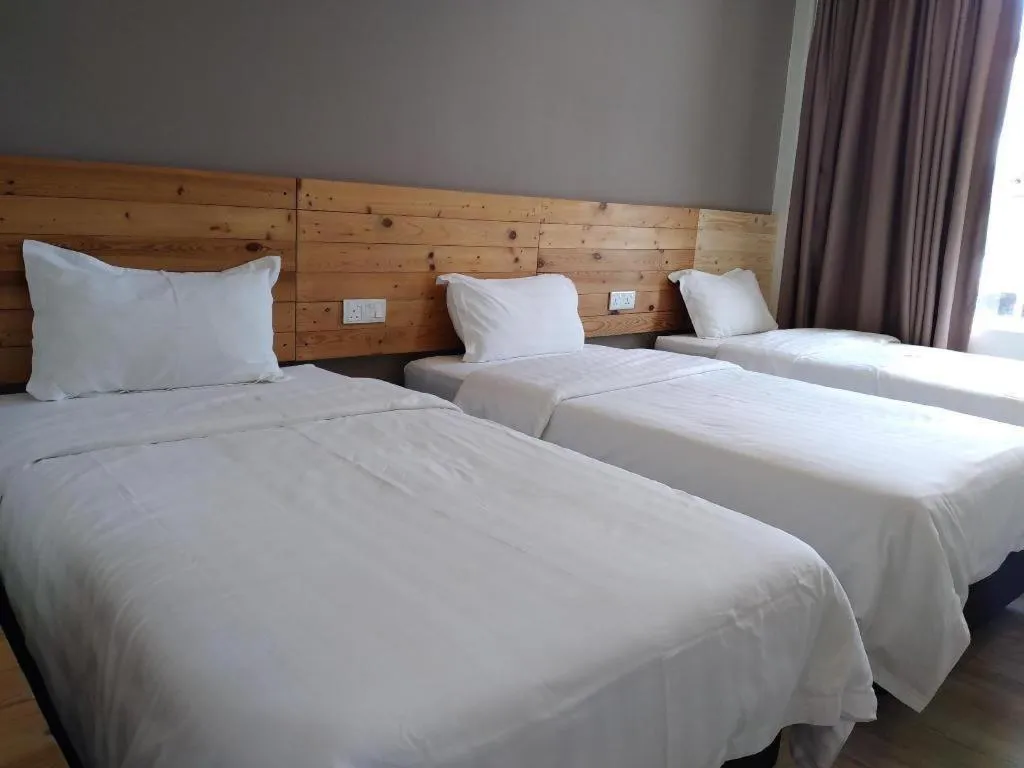 Bed in Sg. Paka Hotel