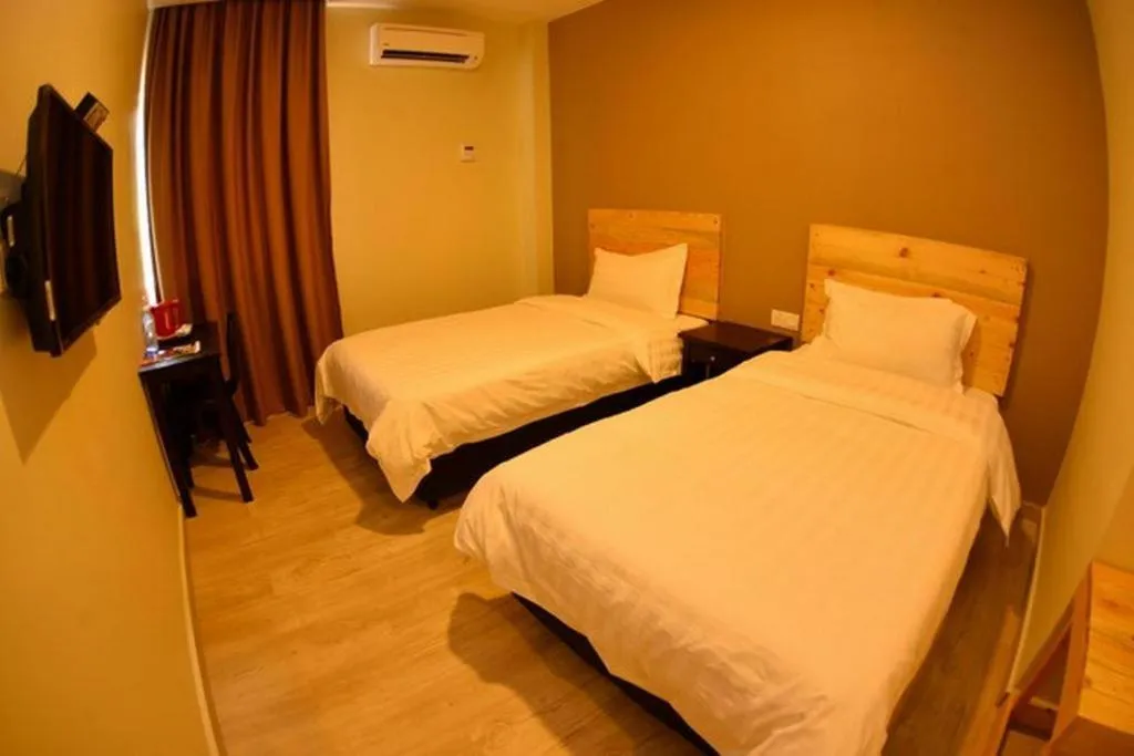 Bed in Sg. Paka Hotel