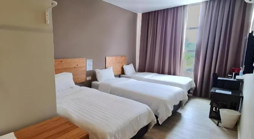 Bed in Sg. Paka Hotel