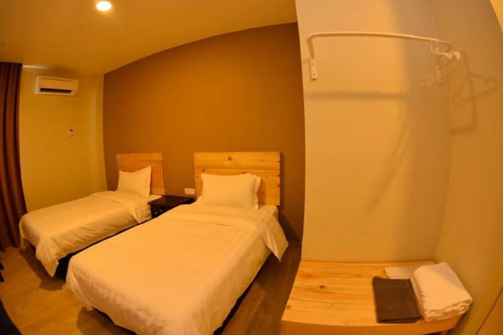 Bed in Sg. Paka Hotel