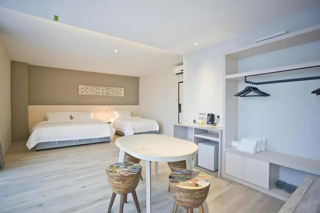 Bed in M Plus Boutique Hotel