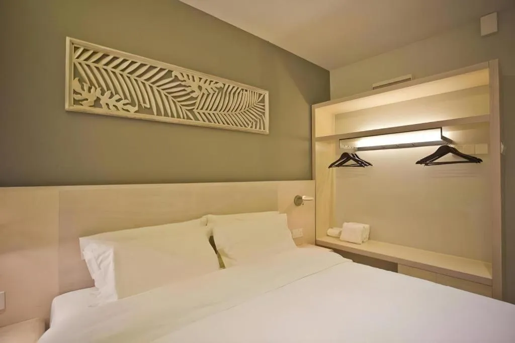 Bed in M Plus Boutique Hotel