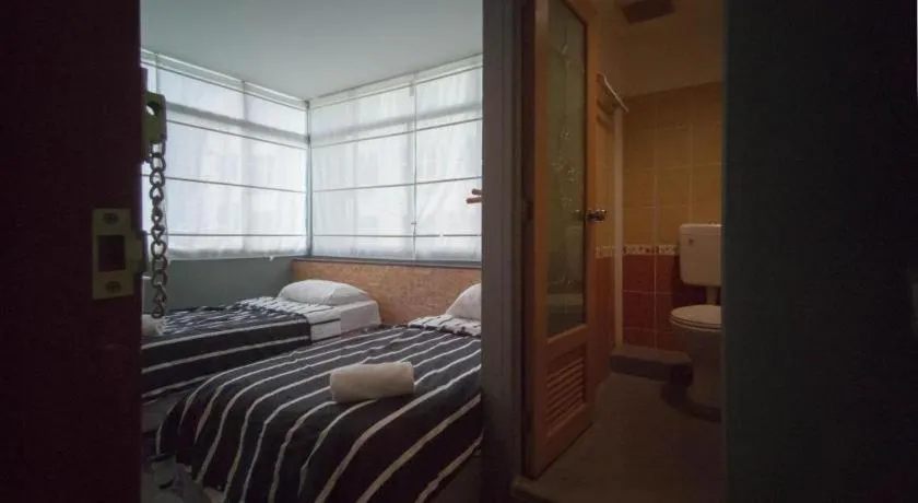 Bed in Koptel Budget Hotel