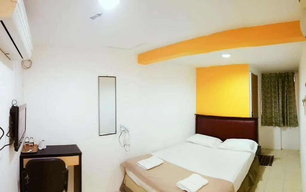 Bed in Twin Star Hotel