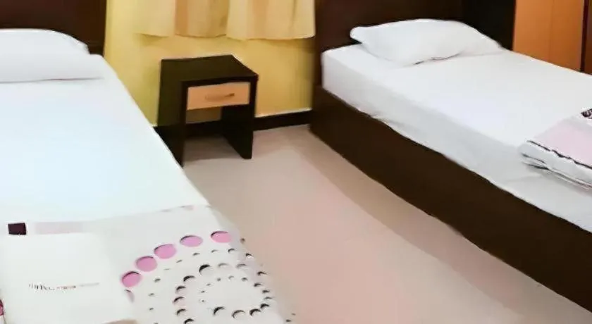 Bed in Twin Star Hotel