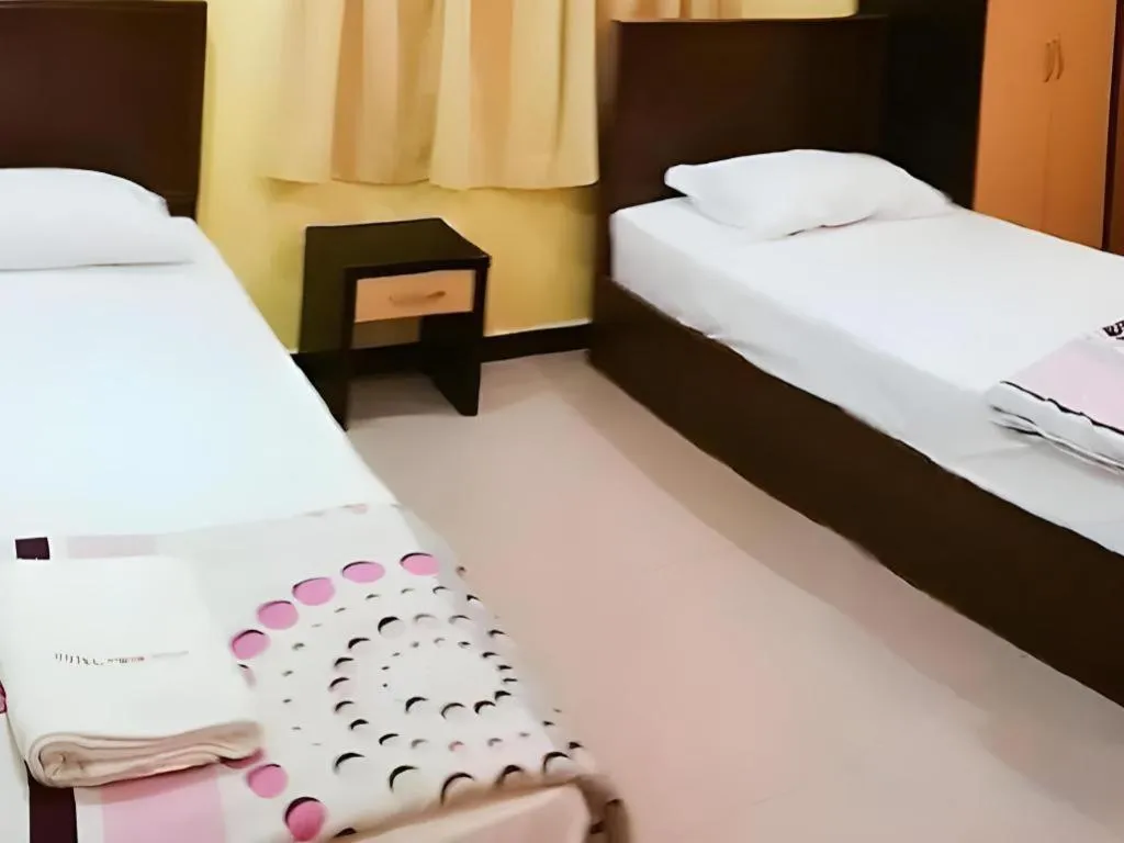 Bed in Twin Star Hotel