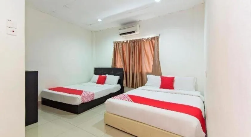 Bed in OYO 304 Zero Hour Hotel