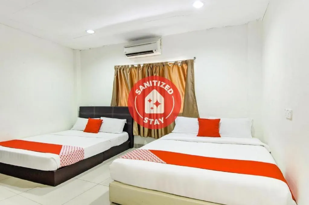 Bed in OYO 304 Zero Hour Hotel