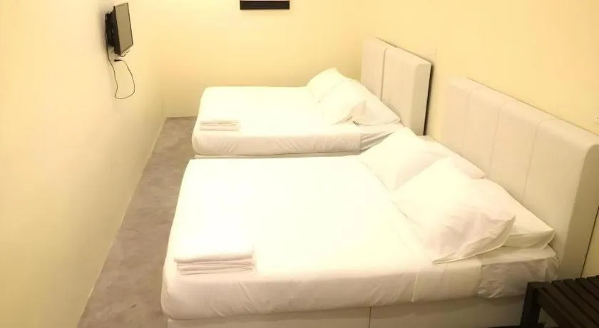 Bed in Hotel Pangkor Mutiara