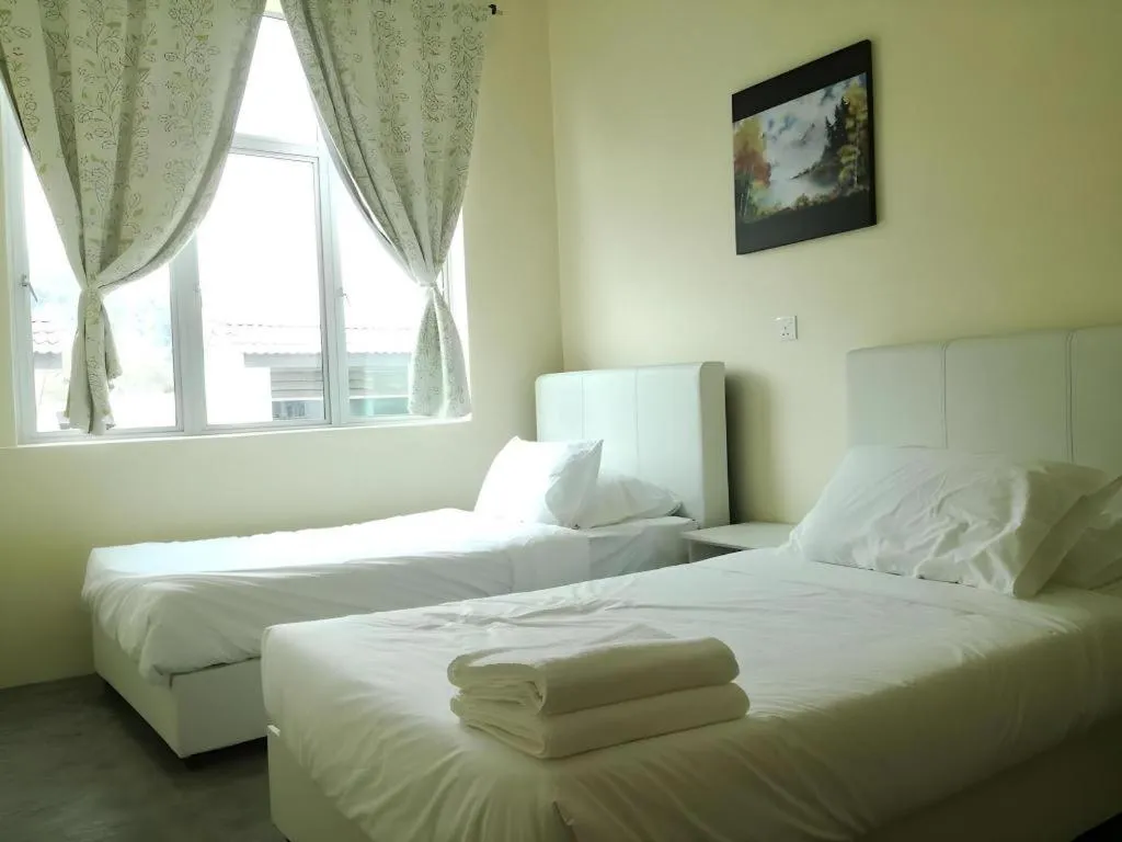 Bed in Hotel Pangkor Mutiara