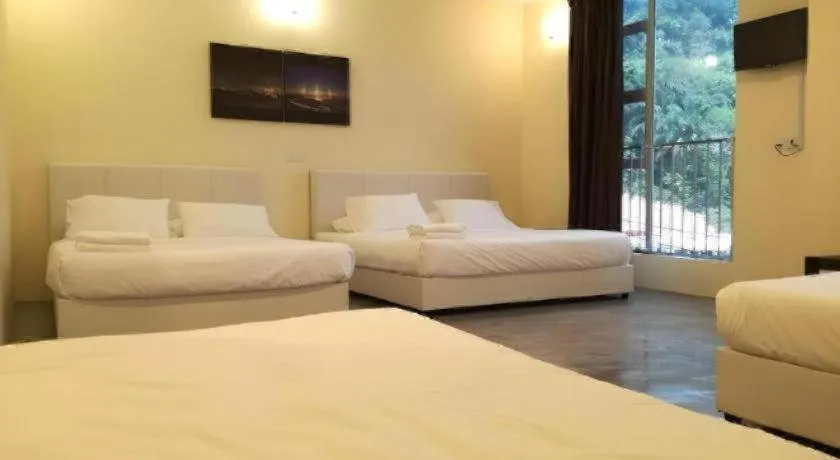 Bed in Hotel Pangkor Mutiara