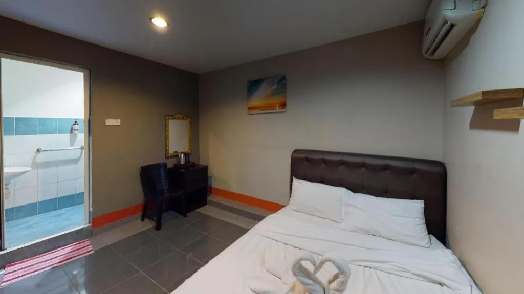 Bed in AMT BUDGET HOTEL