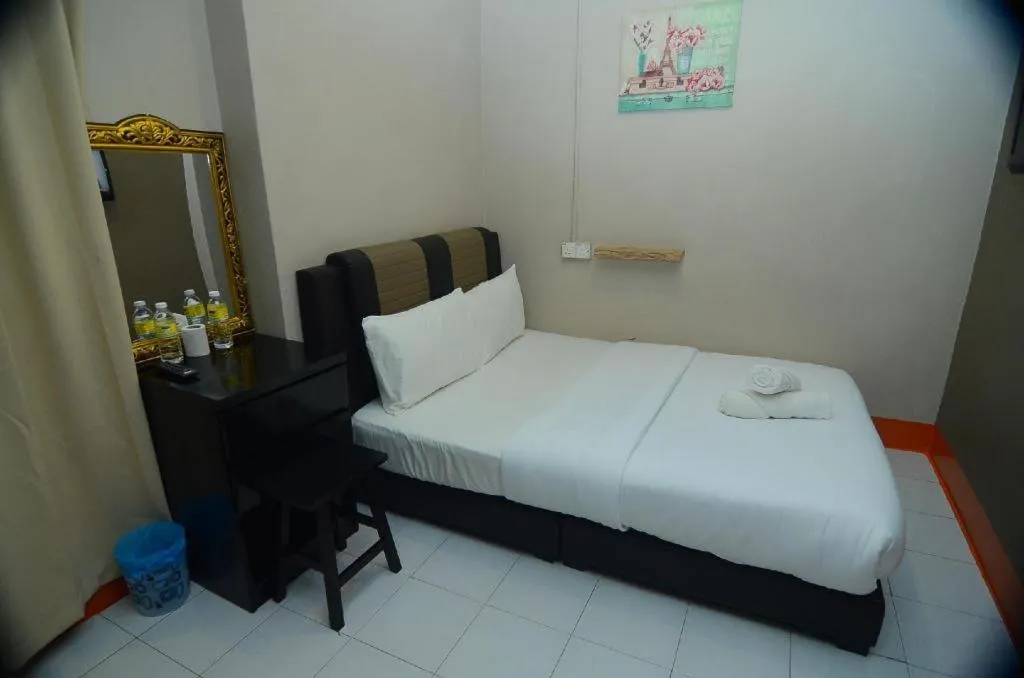 Bed in AMT BUDGET HOTEL