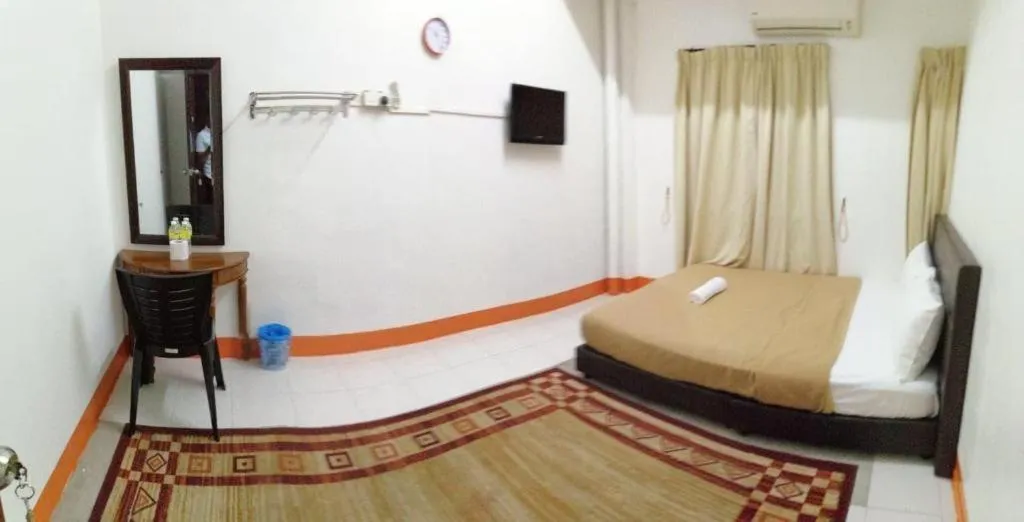 Bed in AMT BUDGET HOTEL
