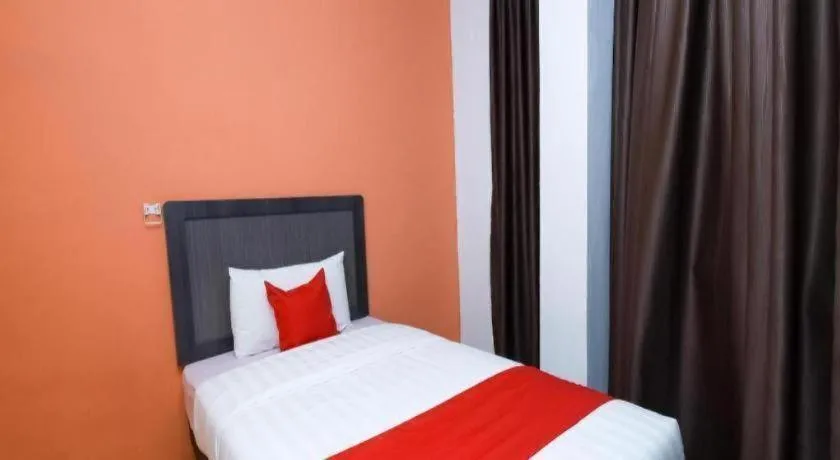 Bed in OYO 1111 Harmony Stay