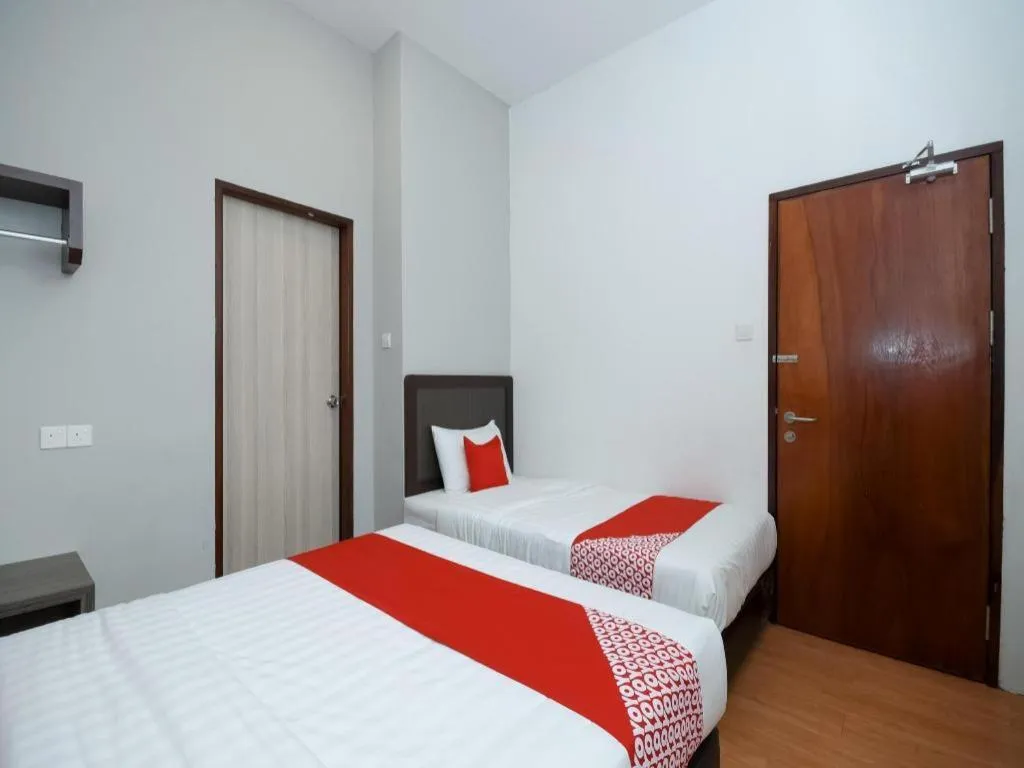 Bed in OYO 1111 Harmony Stay