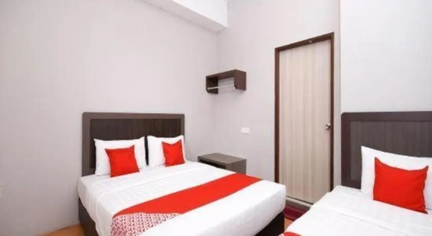 Bed in OYO 1111 Harmony Stay