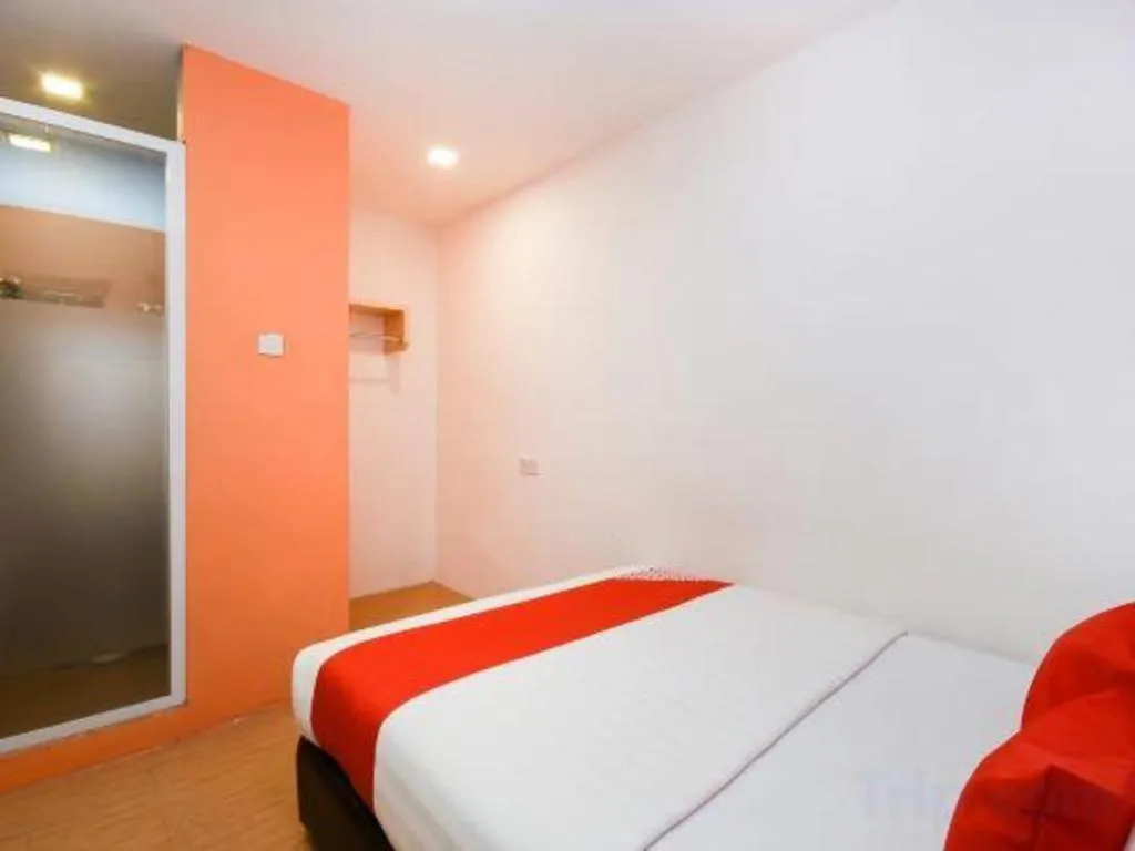 Bed in OYO 1111 Harmony Stay