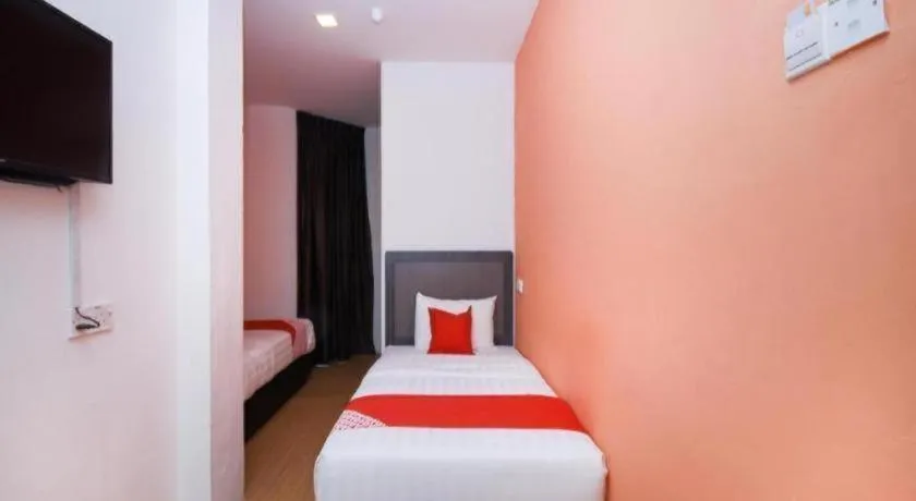 Bed in OYO 1111 Harmony Stay