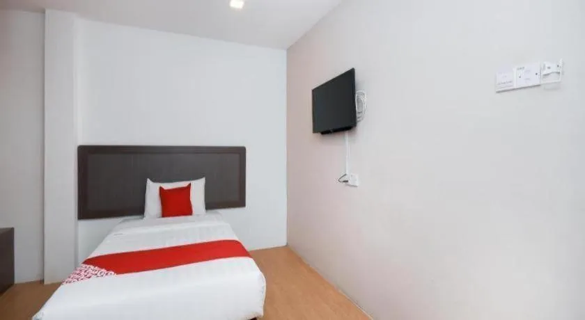 Bed in OYO 1111 Harmony Stay