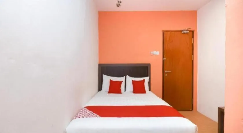 Bed in OYO 1111 Harmony Stay