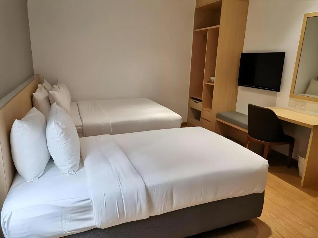 Bed in MIYABI HOTEL PERMAS