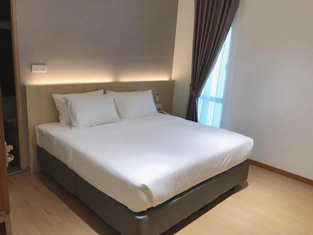 Bed in MIYABI HOTEL PERMAS