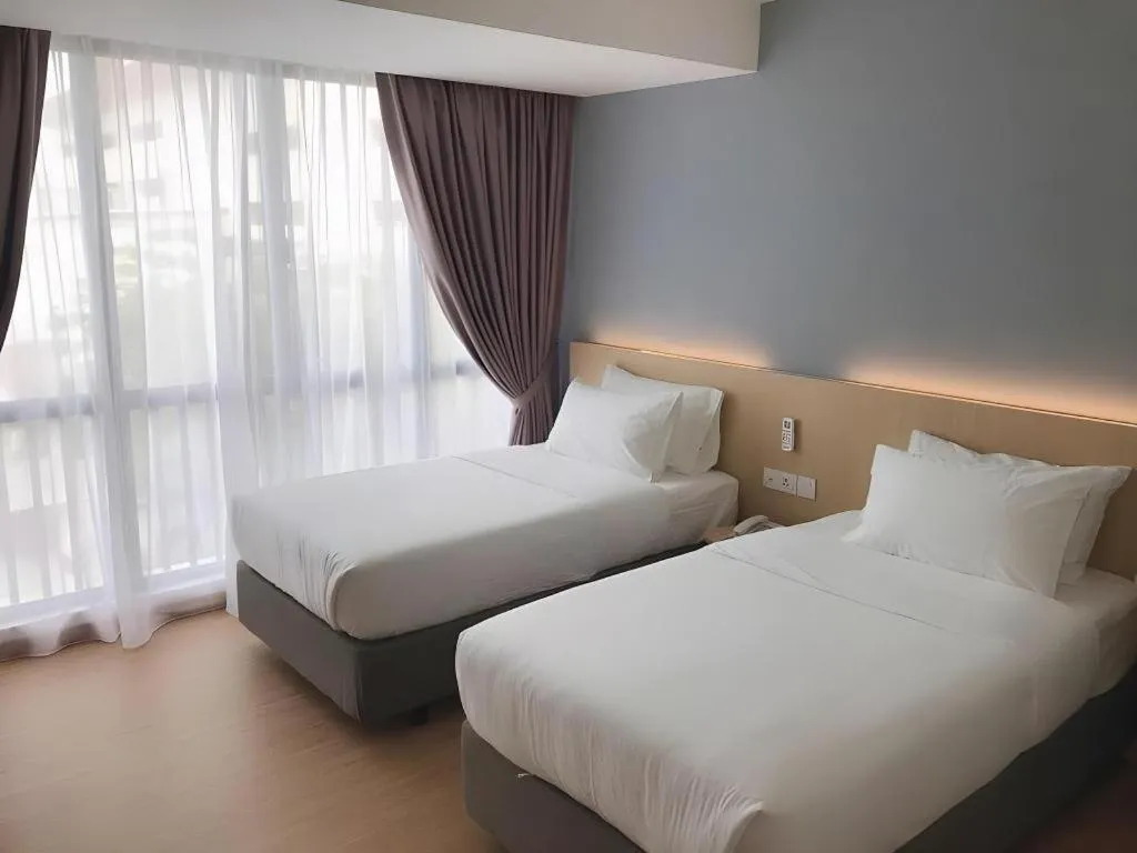 Bed in MIYABI HOTEL PERMAS