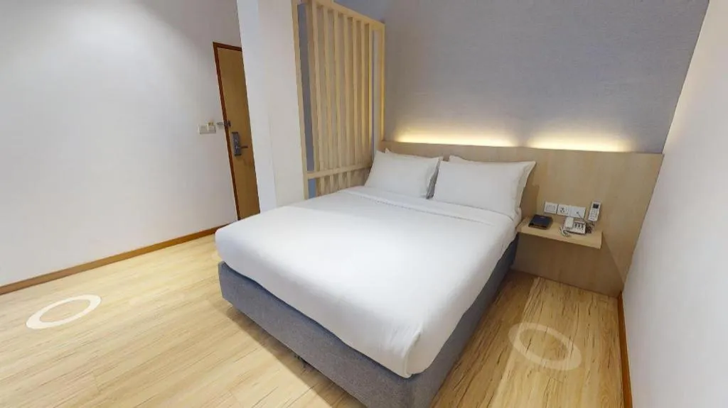 Bed in MIYABI HOTEL PERMAS