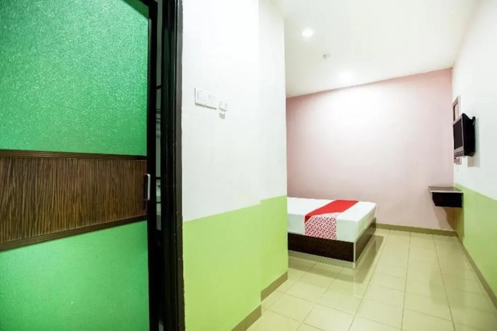 Bed in OYO 89539 Hotel Siswa