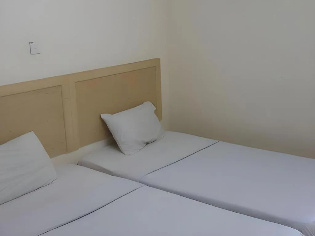 Bed in OYO 301 River Inn Hotel