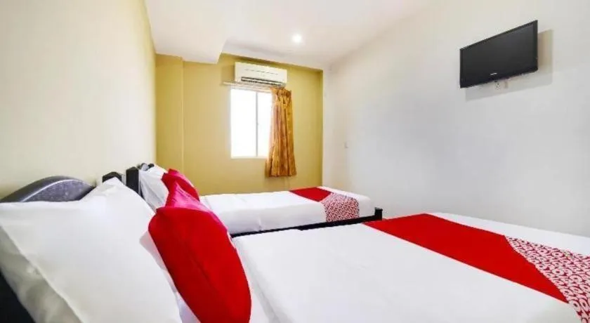 Bed in OYO 44058 MOTEL SRE BAYAM