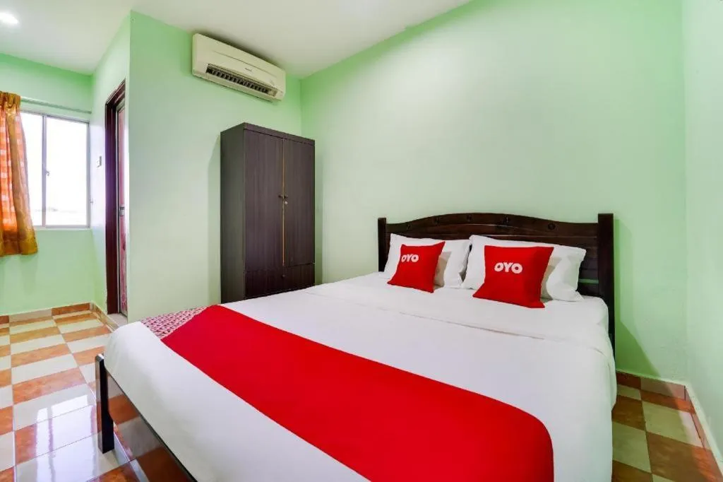 Bed in OYO 44058 MOTEL SRE BAYAM
